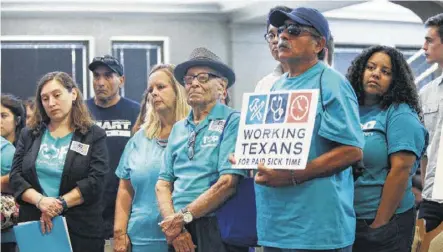  ?? Photos by Jerry Lara / Staff photograph­er ?? Members of Texas Organizing Project stand in support as citizens speak in favor of an ordinance mandating paid sick leave during a San Antonio City Council meeting.