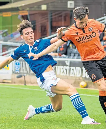  ?? SNS Group. Picture: ?? Danny McNamara gets a tackle in on Dundee United’s Lawrence Shankland on his St Johnstone debut in last weekend’s Premiershi­p opener at Tannadice.