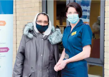  ??  ?? Retired NHS doctor Zubaida Iqbal, 83, with head of nursing Tracey Coulson. Ref:133213-7