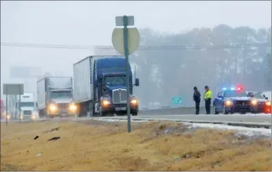  ?? FILE PHOTO ?? The winter storm that swept through Arkansas on Dec. 5 and 6 left enough ice on Tri-Lakes area roadways to cause backups like this one on Interstate 30 northeast of Bryant. While the traffic woes caused by the storm system are a distant memory,...