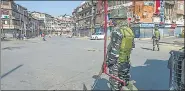  ?? PTI ?? Security personnel stand guard in Srinagar.