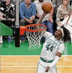  ?? Winslow Townson / Getty Images ?? Robert Williams III dunks during Game 4 of the Eastern finals against the Heat. The Celtics won to even the series, 102-82. For a complete story go to http://timesunion.com/sports.