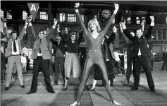  ??  ?? From left: Diana at Waterloo station in 1983, where she encouraged commuters to work out with her, and with the Mudeford Lifeboat Crew in 1989. Below: Diana (centre) on ITV’s Loose Women in March