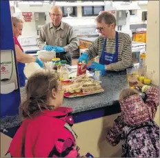  ?? ERIC BOURQUE ?? The breakfast program at Yarmouth Central School. This picture was taken Sept. 26, when volunteers from Central Yarmouth Baptist Church were taking their turn helping with the program. This particular group volunteers with Central School’s breakfast program every Wednesday.