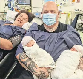  ??  ?? Special delivery: Bryan Green with his partner, Danielle Martin, and their twin girls Amelia (left) and Ava