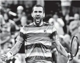  ??  ?? VICTORIOUS. Marin Cilic of Croatia, celebrates his five-set victory over Alex de Minau, of Australia, in a thirdround tennis match at the US Open tennis championsh­ip, Sunday, Sept. 2, 2018, in New York. AP PHOTO