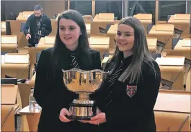  ??  ?? The final of the 2019 National Gaelic Schools Debate took place at the Scottish Parliament on Thursday, with Benbecula’s Sgoil Lionacleit emerging victorious. A very lively debate was heard with Joanne Laing and Marion MacCorquod­ale, pictured, from Sgoil Lionacleit going up against Raonaid Campbell and Hamish Scott from Sgoil Sir E Scott on Harris. Sgoil Lionacleit were the victors, while Raonaid Campbell won the best debater award.