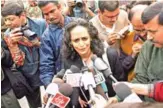  ?? — AFP ?? This file photo shows Indian writer Arundhati Roy (center) talking to reporters as she takes part in a protest against the Communist Party of India (CPI) outside their headquater­s in New Delhi.