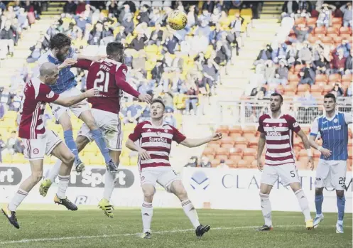  ??  ?? 0 Murray Davidson, second left, heads the winning goal as St Johnstone came from behind to defeat Hamilton on Saturday.