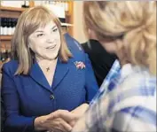  ?? Mariah Tauger For The Times ?? KAMALA HARRIS, right, leads fellow Democrat Loretta Sanchez, left, in the Senate race. Die-hard Democratic donors may be on the sidelines because a Democrat is going to win no matter what, some observers say.