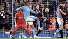  ?? ?? Early strike: Akanji fires in City’s opener in the fifth minute against Copenhagen.