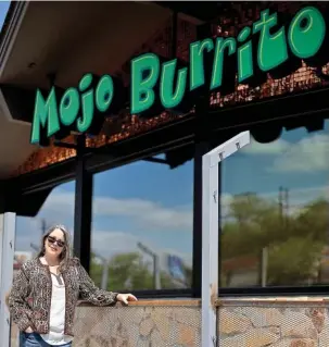  ?? STAFF PHOTO BY TROY STOLT ?? Mojo Burrito owner Eve Williams stands Wednesday in front of Mojo Burrito at 3512 Dayton Blvd., a location that has not opened for business yet. Williams said she is unsure when the franchise will open its doors, adding that a lot will depend on finding employees to work there.