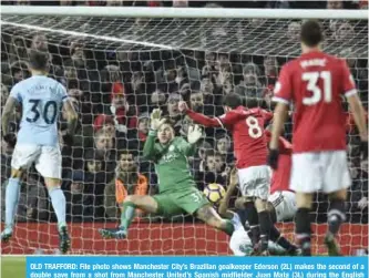  ??  ?? OLD TRAFFORD: File photo shows Manchester City’s Brazilian goalkeeper Ederson (2L) makes the second of a double save from a shot from Manchester United’s Spanish midfielder Juan Mata (3L) during the English Premier League football match between...