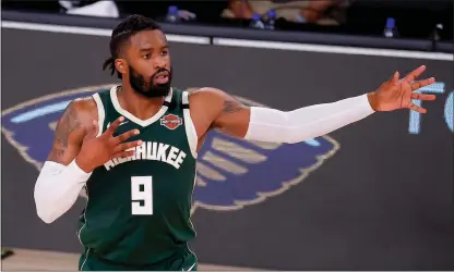  ?? Kevin C. Cox / Getty Images /TNS ?? Wesley Matthews, then of the Milwaukee Bucks, reacts after hitting a 3-point basket against the Dallas Mavericks atthe Arena at ESPN Wide World Of Sports Complex in Augus in Lake Buena Vista, Florida.