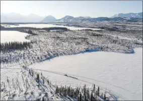  ?? LOREN HOLMES - THE ASSOCIATED PRESS ?? Linwood Fiedler mushes across Submarine Lake near Nikolai, Alaska, Tuesday, March 10, 2020, during the Iditarod Trail Sled Dog Race.