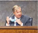  ?? CAROLINE BREHMAN/CQ ROLL CALL ?? Chairman Lindsey Graham, R-S.C., takes off his mask as he arrives for the Sentae Judiciary Committee hearing in Washington on May 12.