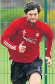  ??  ?? Back in business: Aberdeen defender Scott McKenna