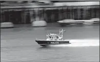  ?? AP/MARKUS SCHREIBER ?? A British police boat patrols the River Thames near London Bridge on Tuesday. Security has become a key issue in the runup to Thursday’s general election in the United Kingdom.