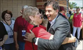  ?? SCOTT OLSON / GETTY IMAGES ?? Ohio Republican congressio­nal candidate Troy Balderson greets guests before a rally with President Donald Trump on Saturday in Lewis Center.