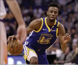  ?? MATT YORK — THE ASSOCIATED PRESS ?? Andrew Wiggins, in his third game with the Warriors, finished with 27 points, four rebounds and five assists in 34minutes Wednesday against the Phoenix Suns.