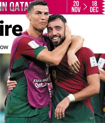  ?? ?? In the spotlight: Portugal’s Cristiano ronaldo hugging bruno Fernandes after beating Uruguay. — ap