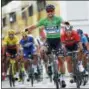  ?? CHRISTOPHE ENA — THE ASSOCIATED PRESS ?? Slovakia’s Peter Sagan, wearing the best sprinter’s green jersey, crosses the finish line ahead of Italy’s Sonny Colbrelli, second right, Belgium’s Philippe Gilbert, second left, and Belgium’s Greg van Avermaet, left, to win the fifth stage of the Tour...