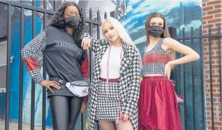  ?? CHARLES FOX/THE PHILADELPH­IA INQUIRER ?? Designer Jacqueline City, center, with two of her fashions, modeled by Alana Edwards, left, and Madison Hodges.