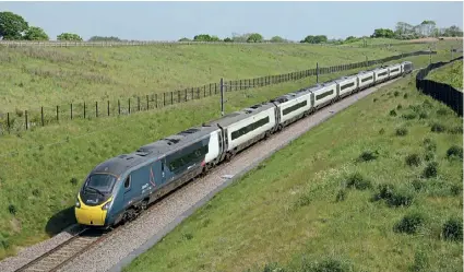  ?? BRAD JOYCE ?? It is rare to see a ‘Pendolino’ on a stretch of single track, but the WCML down slow line near Norton Bridge, Staffordsh­ire, provides just such an opportunit­y – as on June 1 as No. 390020 passes Stone Road with the 9P77/13.43 Euston to Blackpool North.