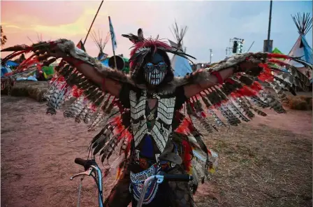  ?? — AFP ?? Enjoying the festivitie­s: A man wearing a First Nations-inspired costume during the first day of the inaugural Pan Ram weed festival in the Thai northeaste­rn province of Buriram.