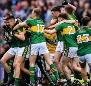  ??  ?? Kerry players celebrate their All-Ireland Minor Championsh­ip Final victory in Croke Park and (right) back in Killarney with their families.
