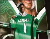  ?? John Locher / Associated Press ?? Cincinnati cornerback Ahmad Gardner poses for photos after being picked by the New York Jets with the fourth pick of the NFL football draft Thursday in Las Vegas.