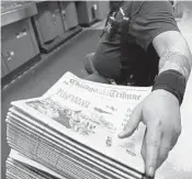  ?? JOHN J. KIM/CHICAGO TRIBUNE 2016 ?? Press crew supervisor Steve Bayer oversees his workers as they check for registrati­on and clarity of the Chicago Tribune at the Freedom Center in Chicago.