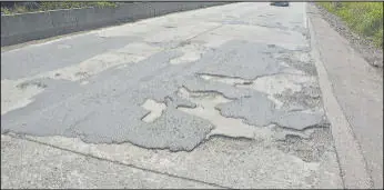  ??  ?? Potholes on Mumbra bypass in Thane poses danger to motorist.
PRAFUL GANGURDE/HT