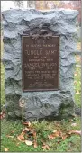  ?? LAUREN HALLIGAN - MEDIANEWS GROUP ?? A new War of 1812grave marker is placed near a memorial at Samuel “Uncle Sam” Wilson’s gravesite at Oakwood Cemetery in Troy.