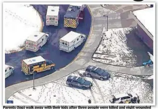  ?? AP ?? Parents (top) walk away with their kids after three people were killed and eight wounded Tuesday at Oxford High School in Michigan (below). Police took a suspect into custody at the scene but did not immediatel­y have a motive.