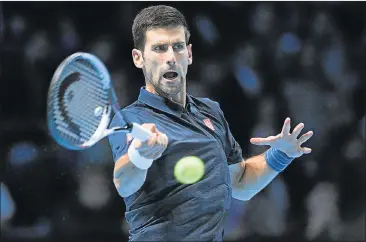  ?? Picture: EPA ?? TAKE THAT: Serbia’s Novak Djokovic returns to Canada’s Milos Raonic during their singles match at the ATP World Tour finals at the O2 Arena in London