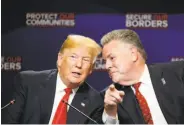  ?? Tom Brenner / New York Times ?? President Trump huddles with GOP Rep. Peter King (R-N.Y.) at a discussion on immigratio­n.