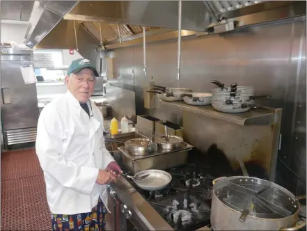  ?? FRAN MAYE — MEDIANEWS GROUP ?? Charlie Sharp tends to the grill at Station 52in Kennett Township. He is working with school districts to provide food to those who need it.