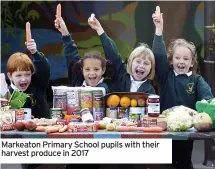  ??  ?? Markeaton Primary School pupils with their harvest produce in 2017