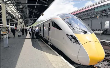  ?? Jonathan Myers ?? > One of the new Hitachi bi-mode trains visiting Swansea station after the announceme­nt that they are to run between Paddington and the city