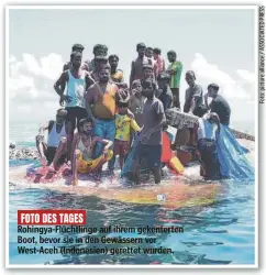  ?? ?? FOTO DES TAGES
Rohingya-Flüchtling­e auf ihrem gekenterte­n Boot, bevor sie in den Gewässern vor West-Aceh (Indonesien) gerettet wurden.