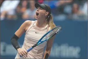  ?? The Associated Press ?? RETURN ENDS: Maria Sharapova, of Russia, reacts after scoring a point against Anastasija Sevastova, of Latvia, during the fourth round of the U.S. Open tennis tournament Sunday in New York. Sharapova fell in the third set to Anastasija Sevastova of...