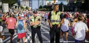  ?? BRANDEN CAMP / FOR AJC 2017 ?? Atlanta police keep watch on Peachtree Street at last year’s AJC Peachtree Road Race.