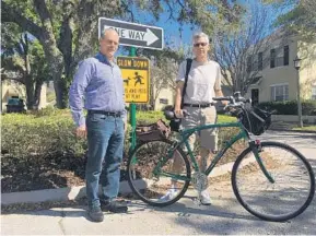  ?? RYAN GILLESPIE/STAFF FILE ?? Celebratio­n residents Geoff Mouen, left, and Floyd McCollum, right, are among many who were concerned about a recommenda­tion to ban on-street parking.