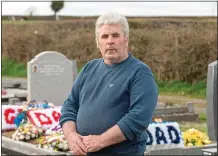  ??  ?? loss: Vincent Keegan at the graveside of his father John in Killourney Cemetery Ferbane, Co. Offaly, yesterday