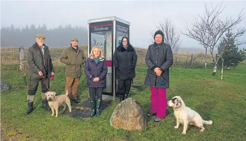  ?? Photograph by Jason Hedges ?? SAVE A LIFE: From left, Dave Macleod, Adam Howarth, Helen Dickinson, Zoe Howarth and Marion Robertson, of the Dava Moor Residents Associatio­n, which is fundraisin­g to install a defibrilla­tor in a former phone box due to emergency support fears.