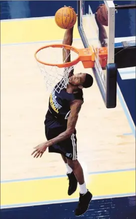  ?? Photos by Mike Brown/the Commercial Appeal ?? Former University of Memphis star forward Will Barton took to the FedExForum practice court on Tuesday for a pre-draft workout with the Grizzlies operations staff.