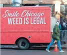  ?? KAMIL KRZACZYNSK­I AFP VIA GETTY IMAGES ?? A food truck sits outside the Sunnyside Cannabis Dispensary on Wednesday in Chicago.