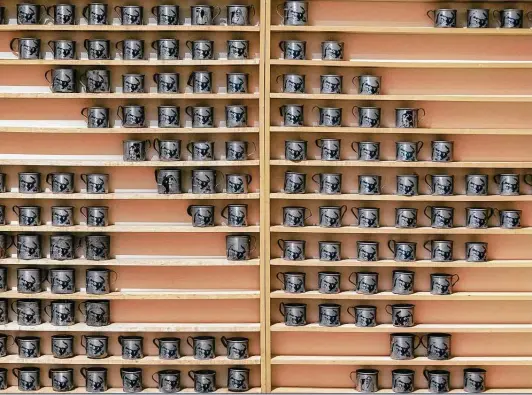  ?? Photos by William Luther / Staff photograph­er ?? The mugs in “Adjie Gilas,” an installati­on by Indo-surinamese artist Dhiradj Ramsamoedj, are arranged in an array based on the layout of his grandparen­ts’ home.