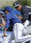  ?? KATHY WILLENS/THE ASSOCIATED PRESS ?? Yankees third baseman Alex Rodriguez misses the tag on Jays baserunner Ryan Goins in the sixth.